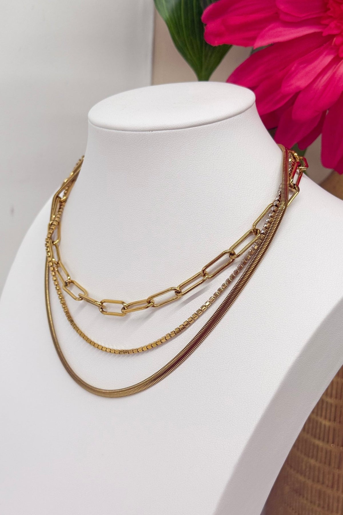 Layered chain necklace set with clear stones