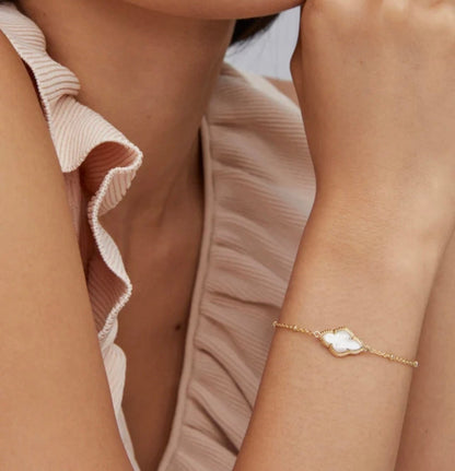 Ivory mother of pearl beads on a gold chain bracelet