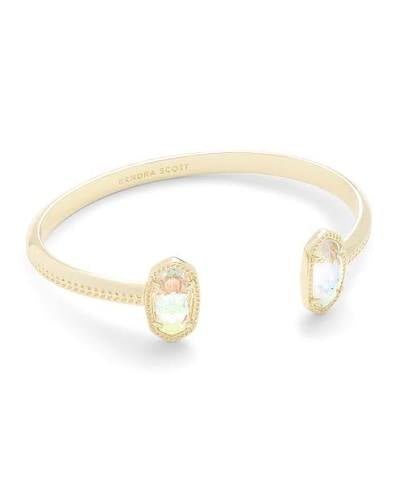 Gold cuff bracelet with a dichroic glass stone