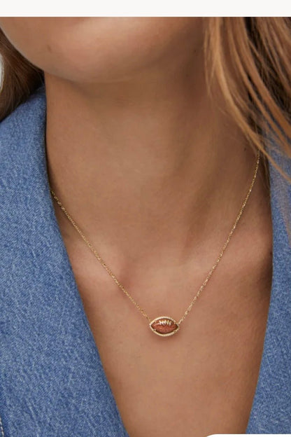 Gold necklace with a game day football charm