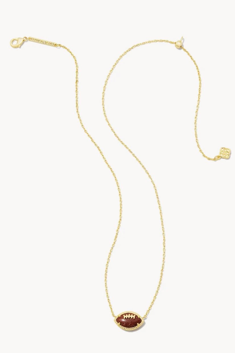 Orange football-shaped pendant on a gold chain