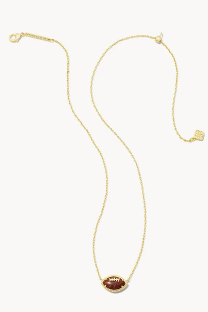 Orange football-shaped pendant on a gold chain