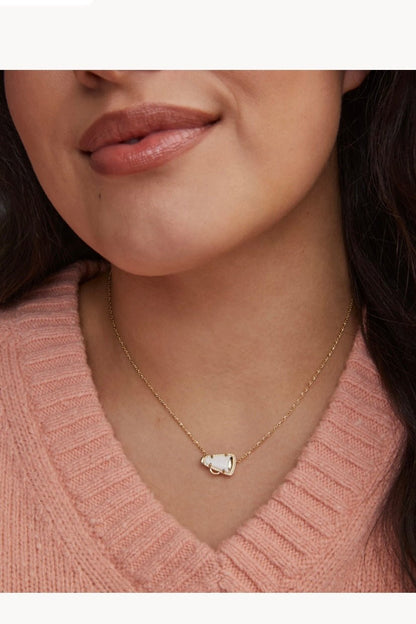White mother of pearl pendant on a gold chain