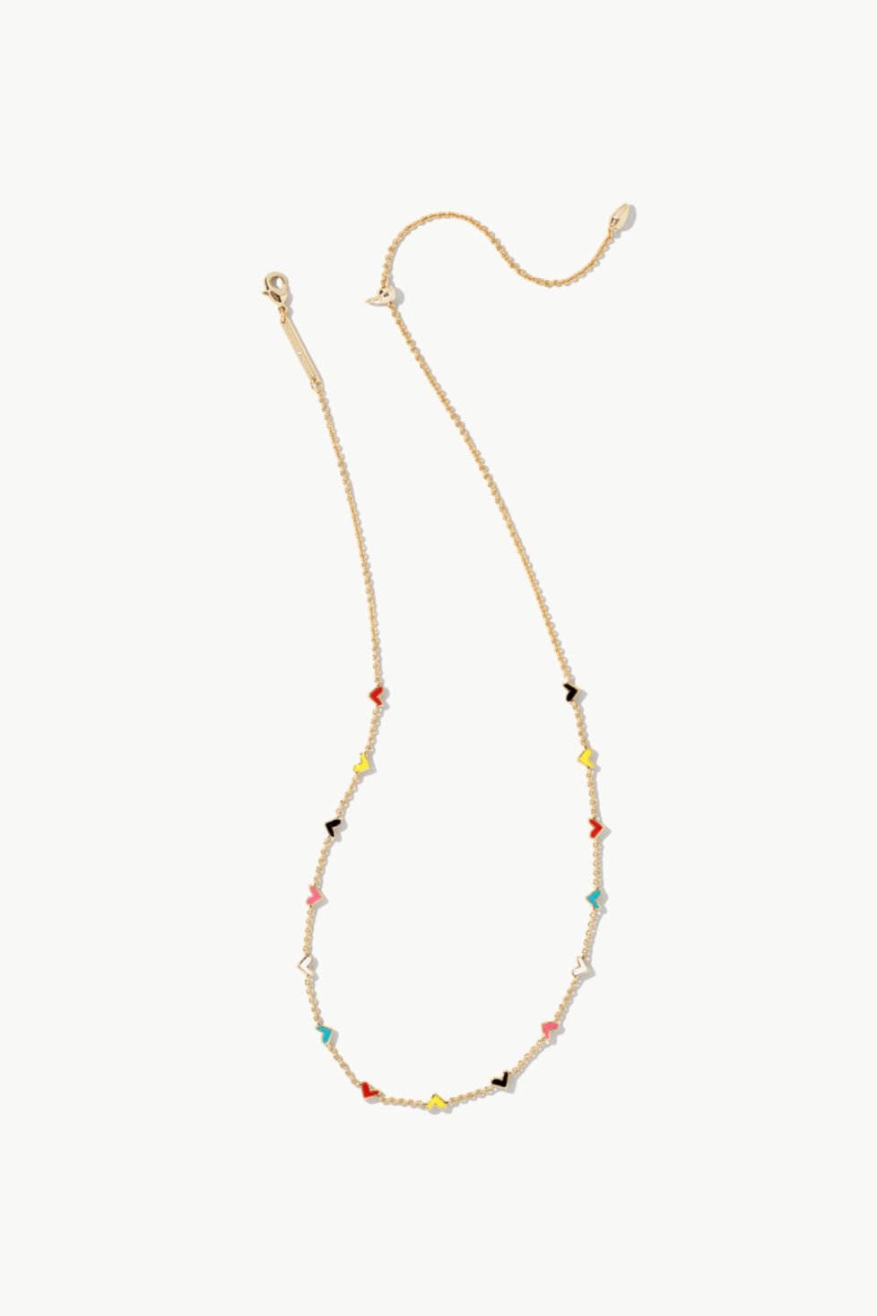 Layered gold heart charm necklace in a mixed metal finish