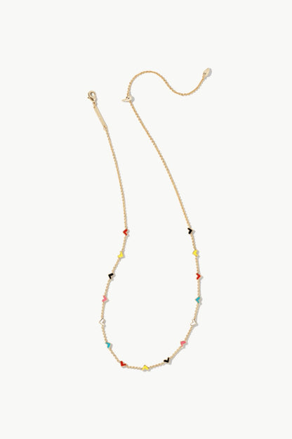 Layered gold heart charm necklace in a mixed metal finish