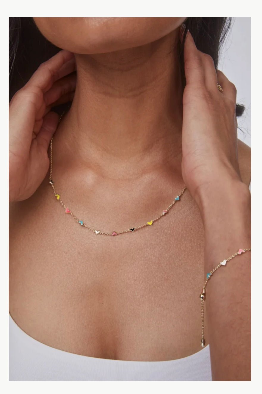 Gold necklace with mixed heart charms