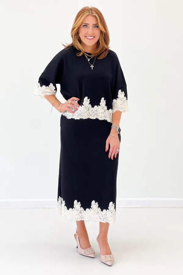 Black two piece top and skirt set with lace detail