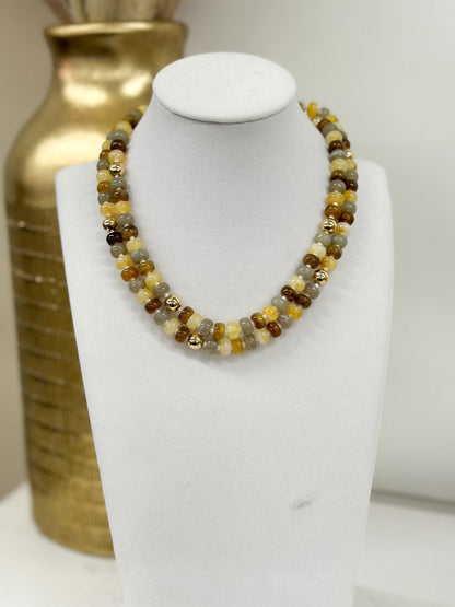 Choker with several strands of polished marble beads