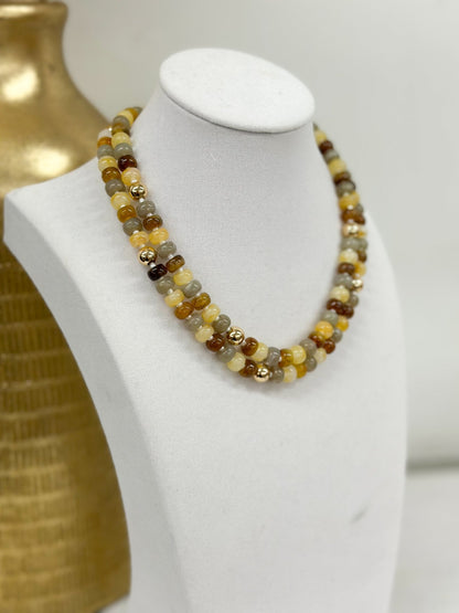 Layered bead choker mixing marble stones and gold metal