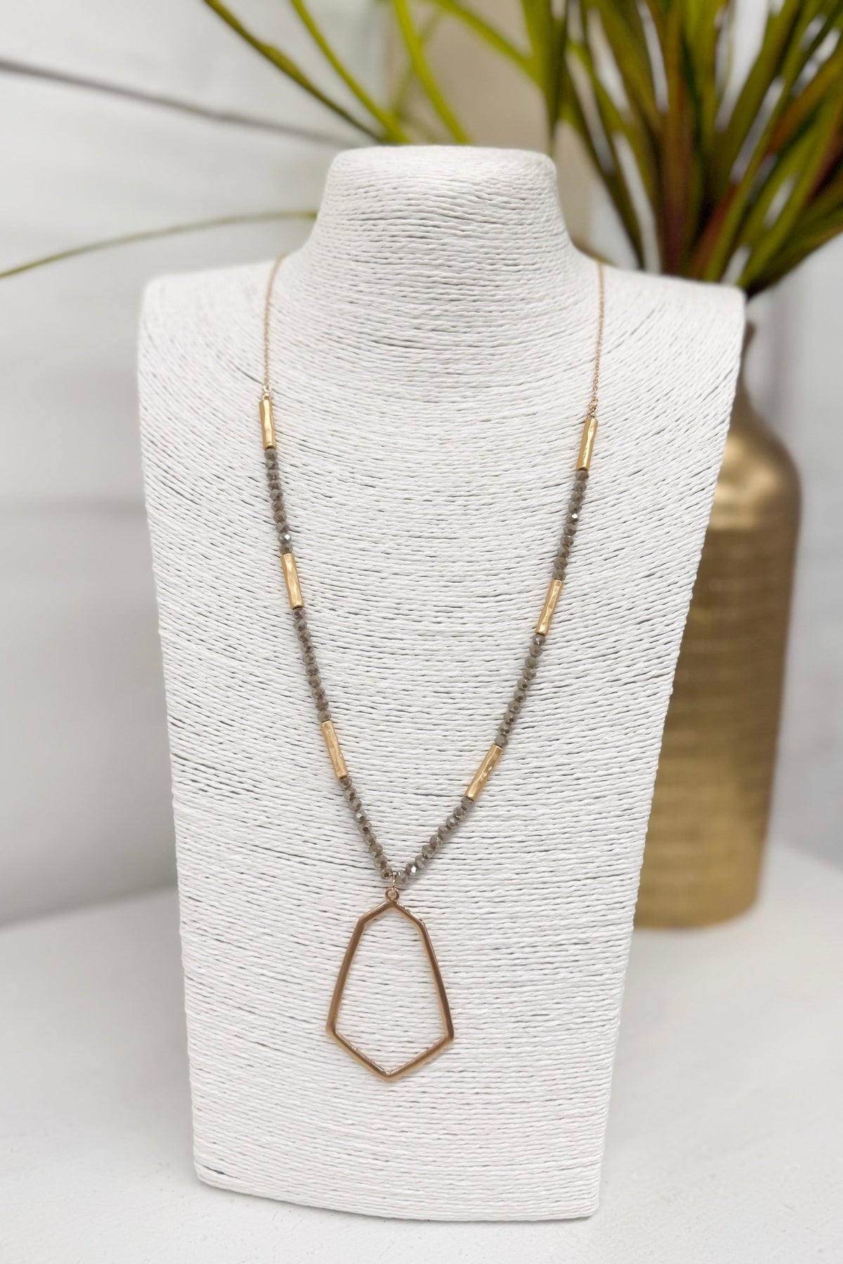 Light mocha beaded necklace with a hexagon pendant