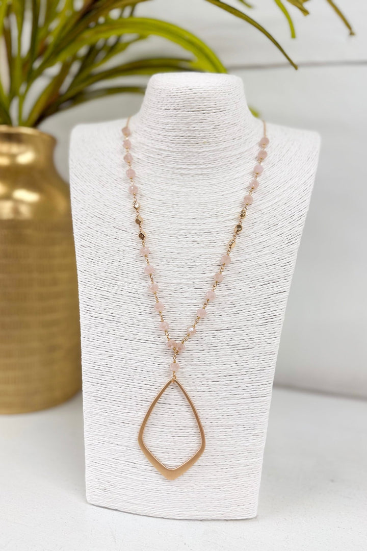 Light pink glass bead necklace with metal accents