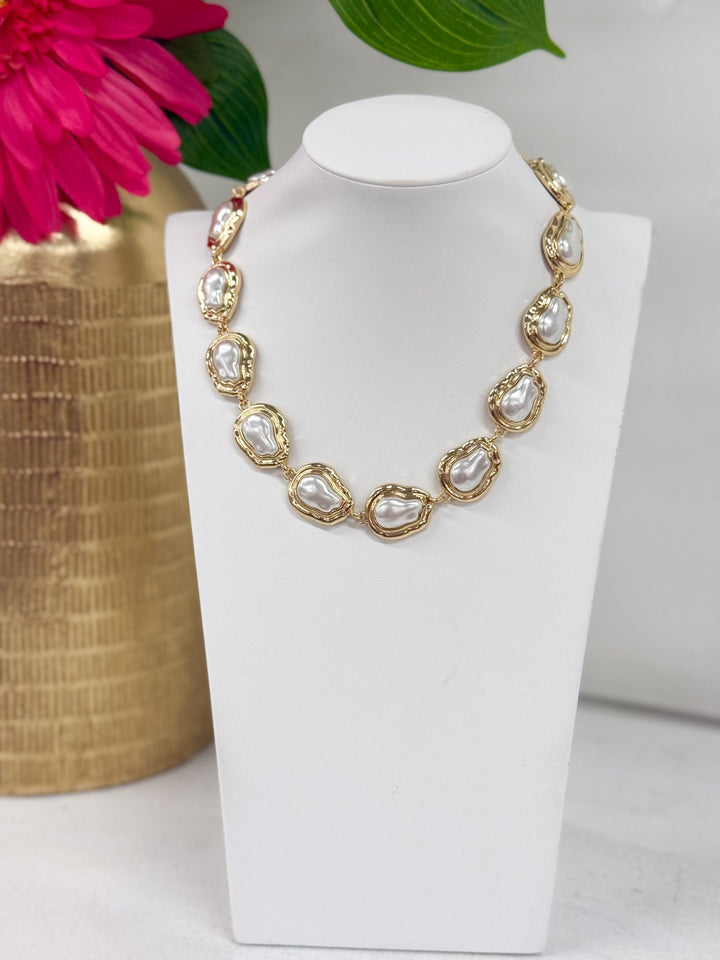 Cream baroque pearls linked into a necklace