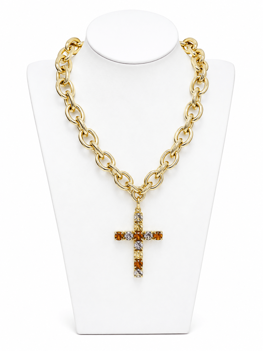 Pave crystal cross hanging from a strand of faceted beads