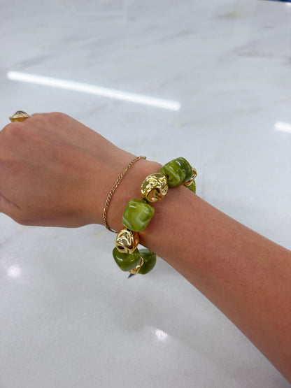 Multi bead bracelet with gold-tone spacers