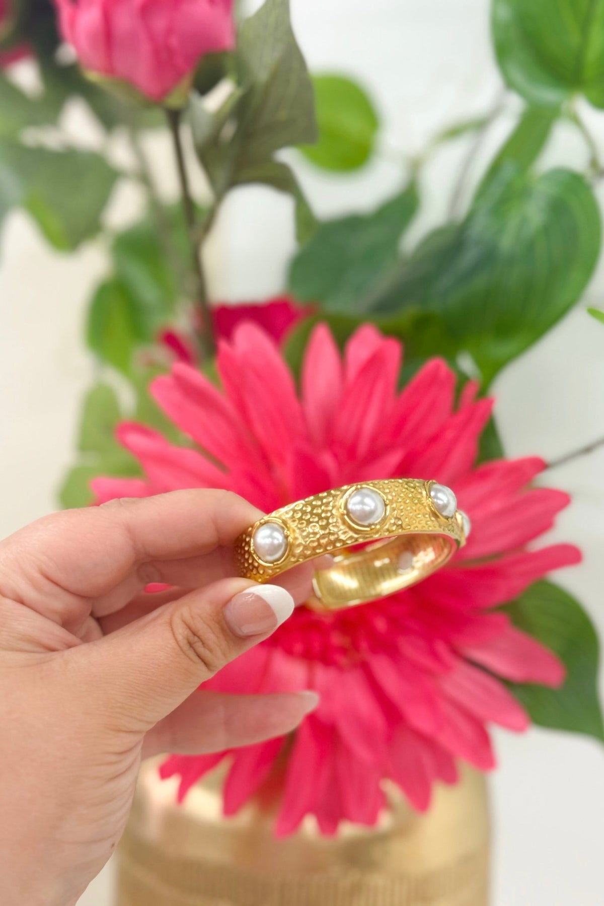 Pearl accented bangle bracelet in gold