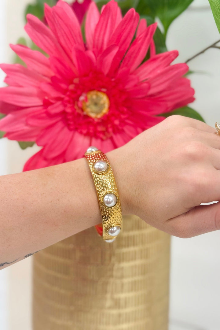 Gold bangle set with pearls