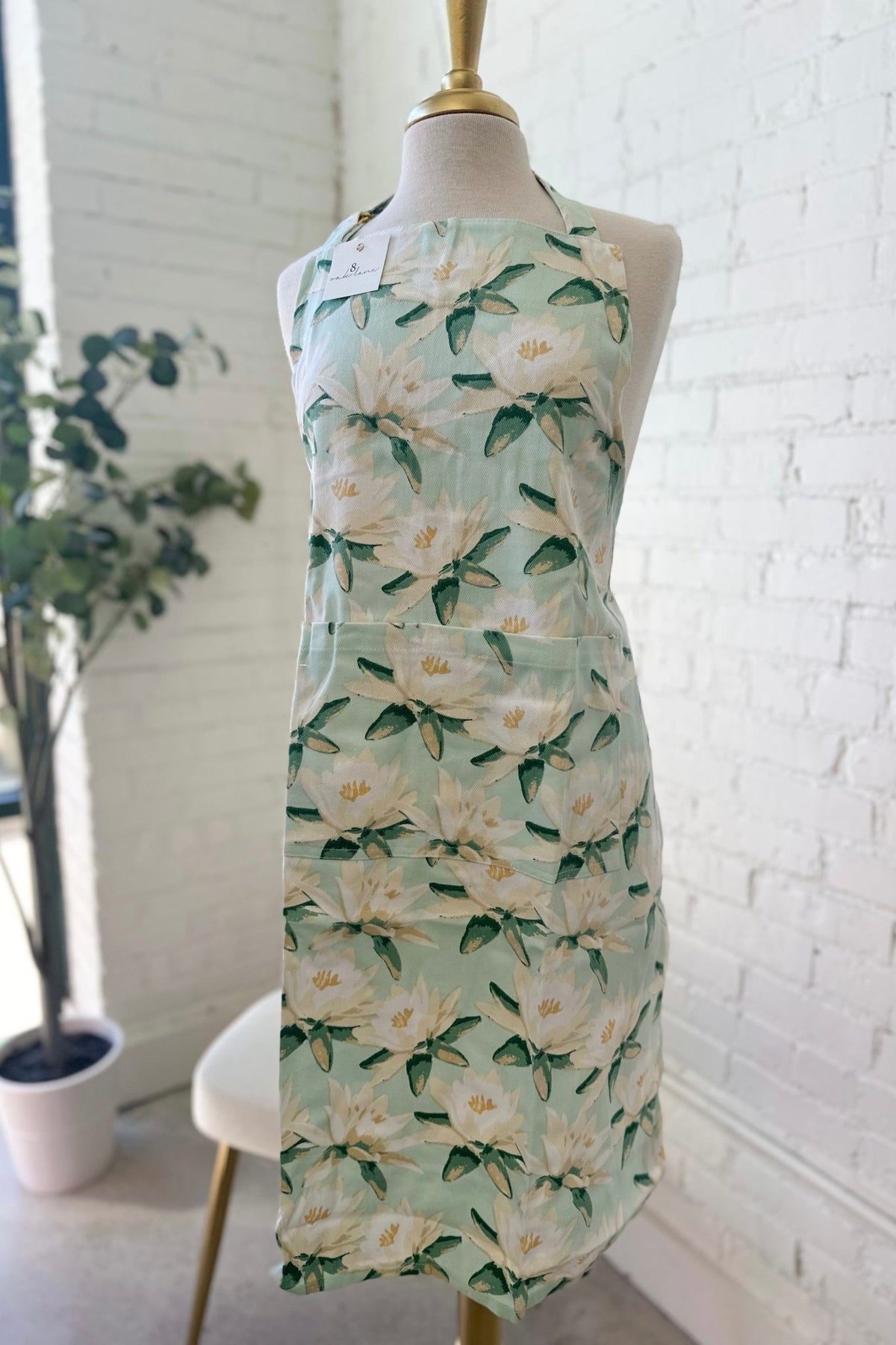 Mint apron with a magnolia print