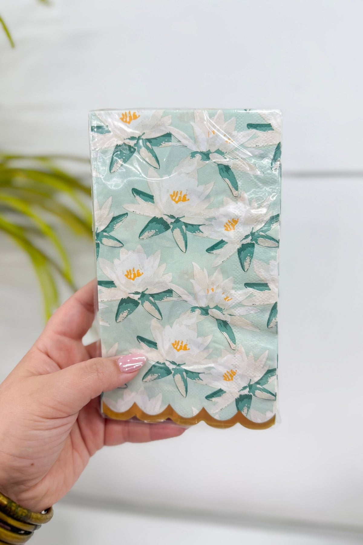 Pack of paper guest towels in a mint magnolia print