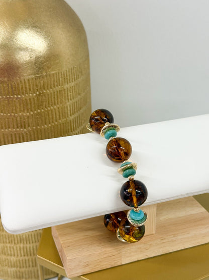Turquoise and tortoise beaded bracelet with disk accents