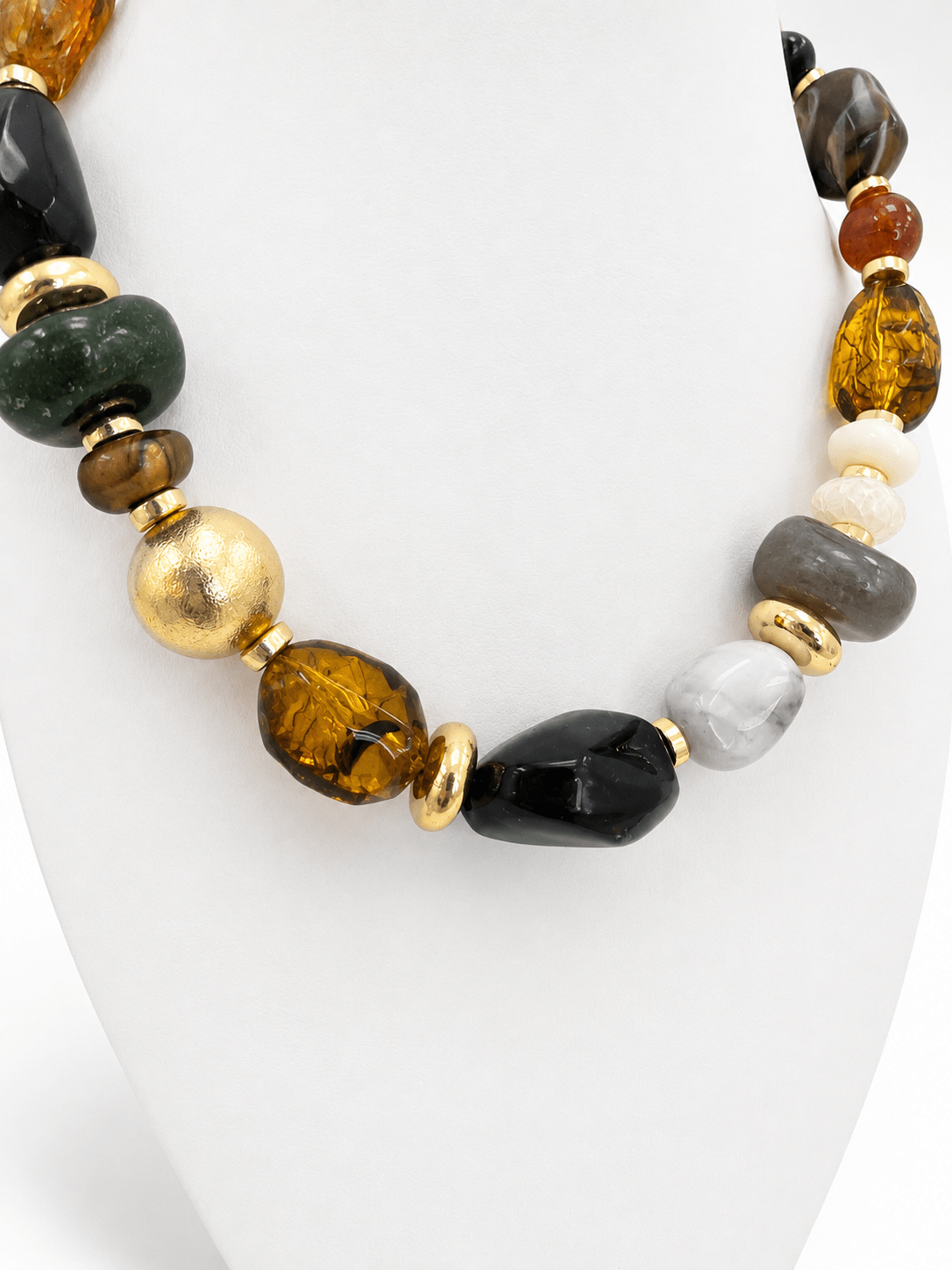 Gold-tone necklace with black marble stones in mixed shapes