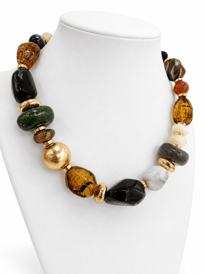 Black marble stones and gold accents in a multi-shaped necklace