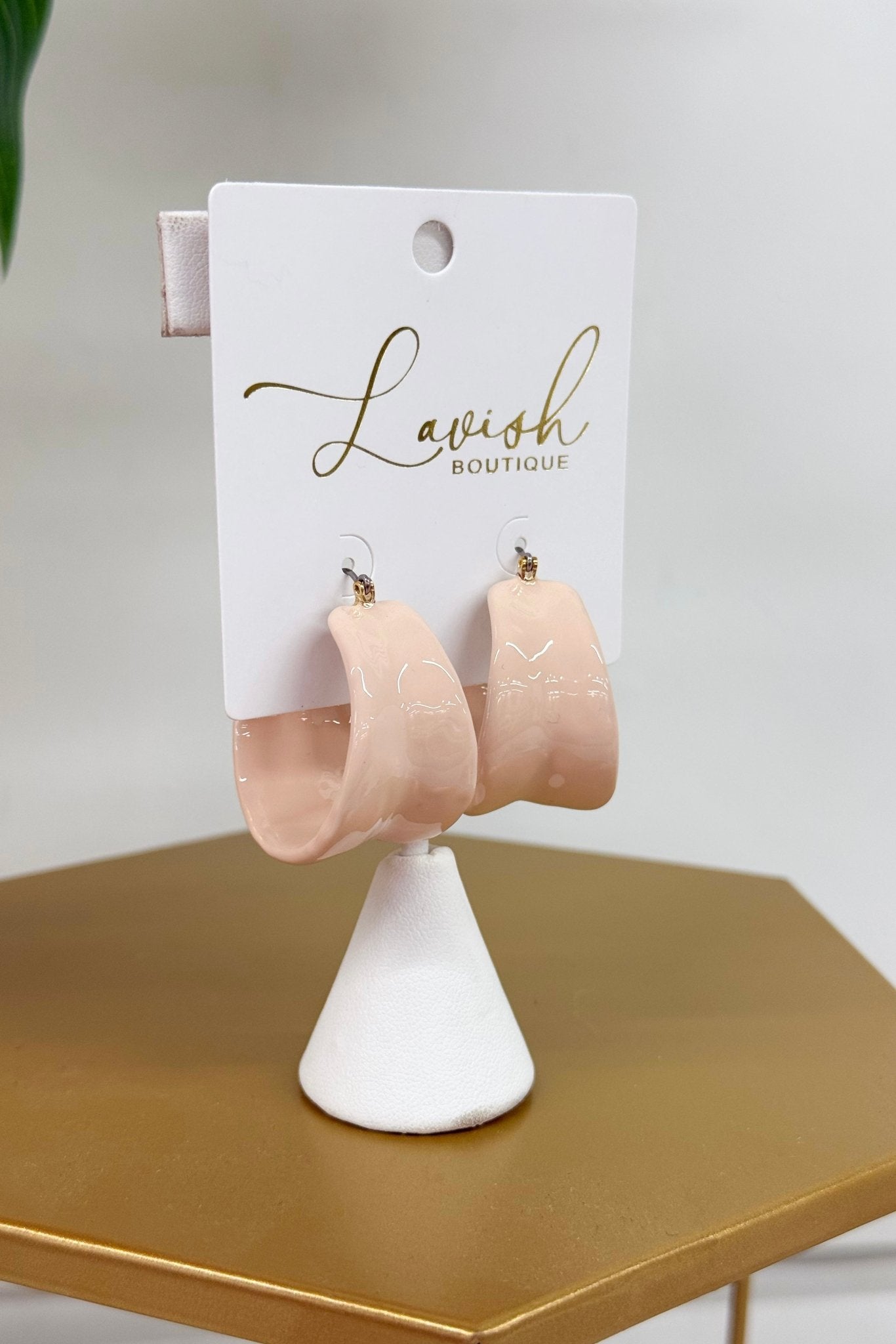 Wide colored hoop earrings in mauve