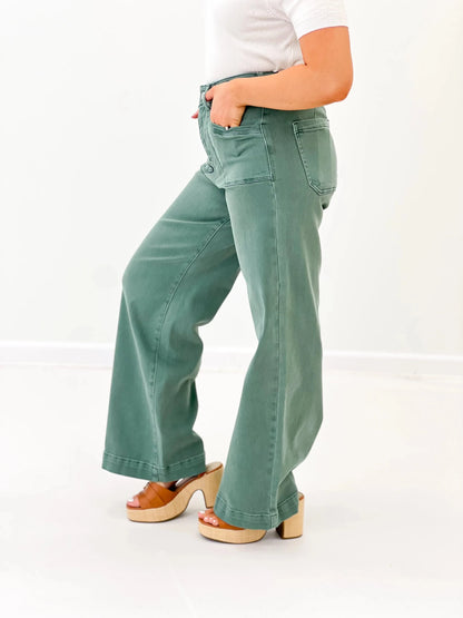 Green high rise wide leg pants with a five pocket cut