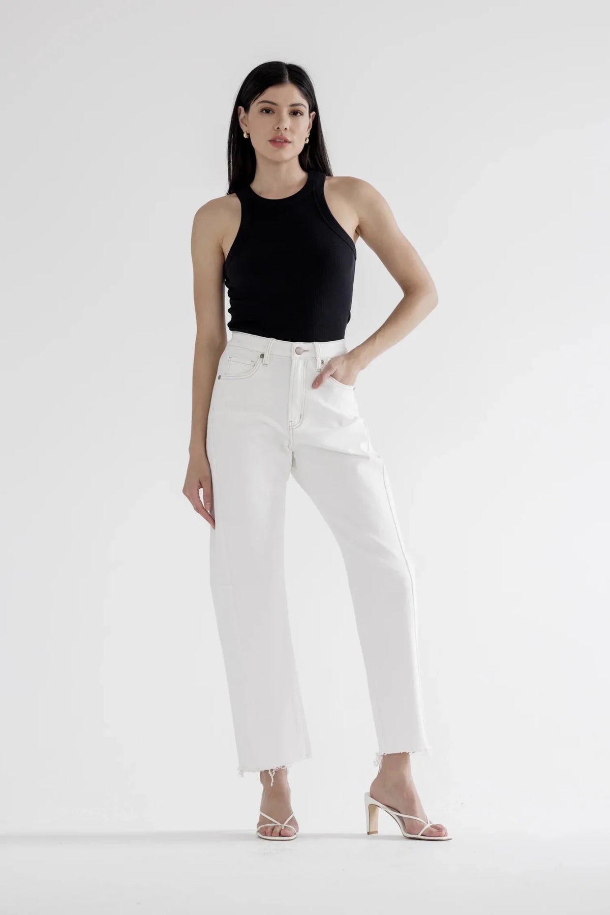 White high rise wide leg jeans with a raw hem