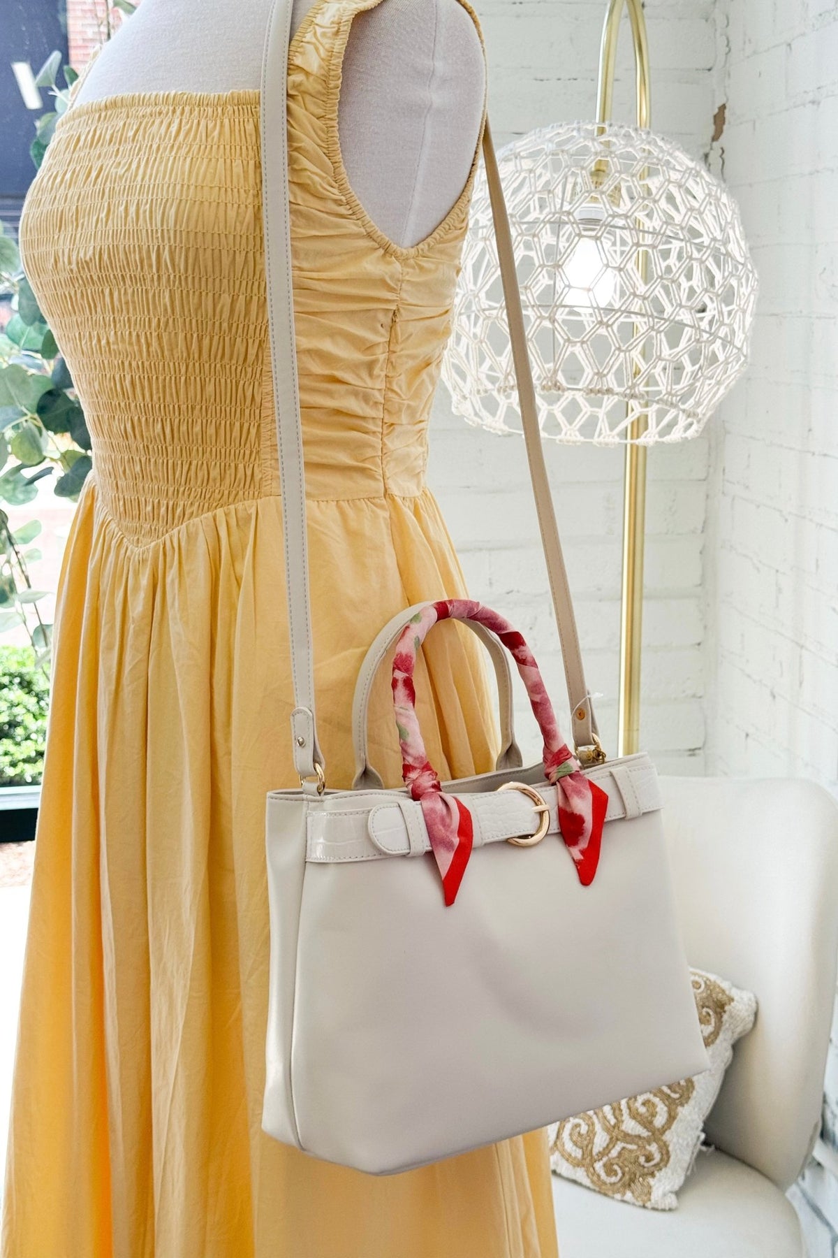 White mini bag with a scarf-wrapped handle