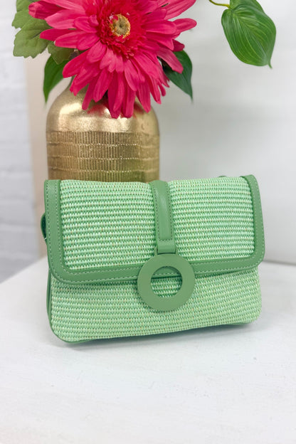 Mint straw crossbody bag with a woven body
