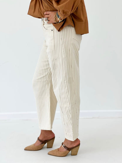 Pinstriped cream barrel pants with a high waist