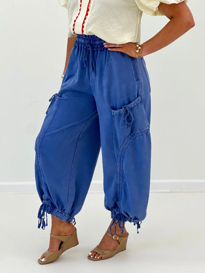 Wide leg pants with a tie belt and flat front pockets