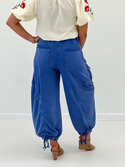 Tie waist wide leg pants with a long fluid leg