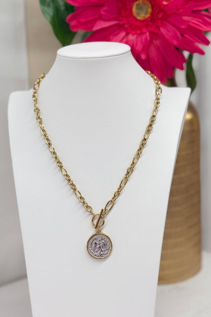 Coin charm on a two-tone chain necklace