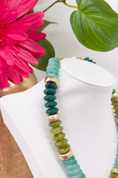 Strand of olive green beads with gold rounds