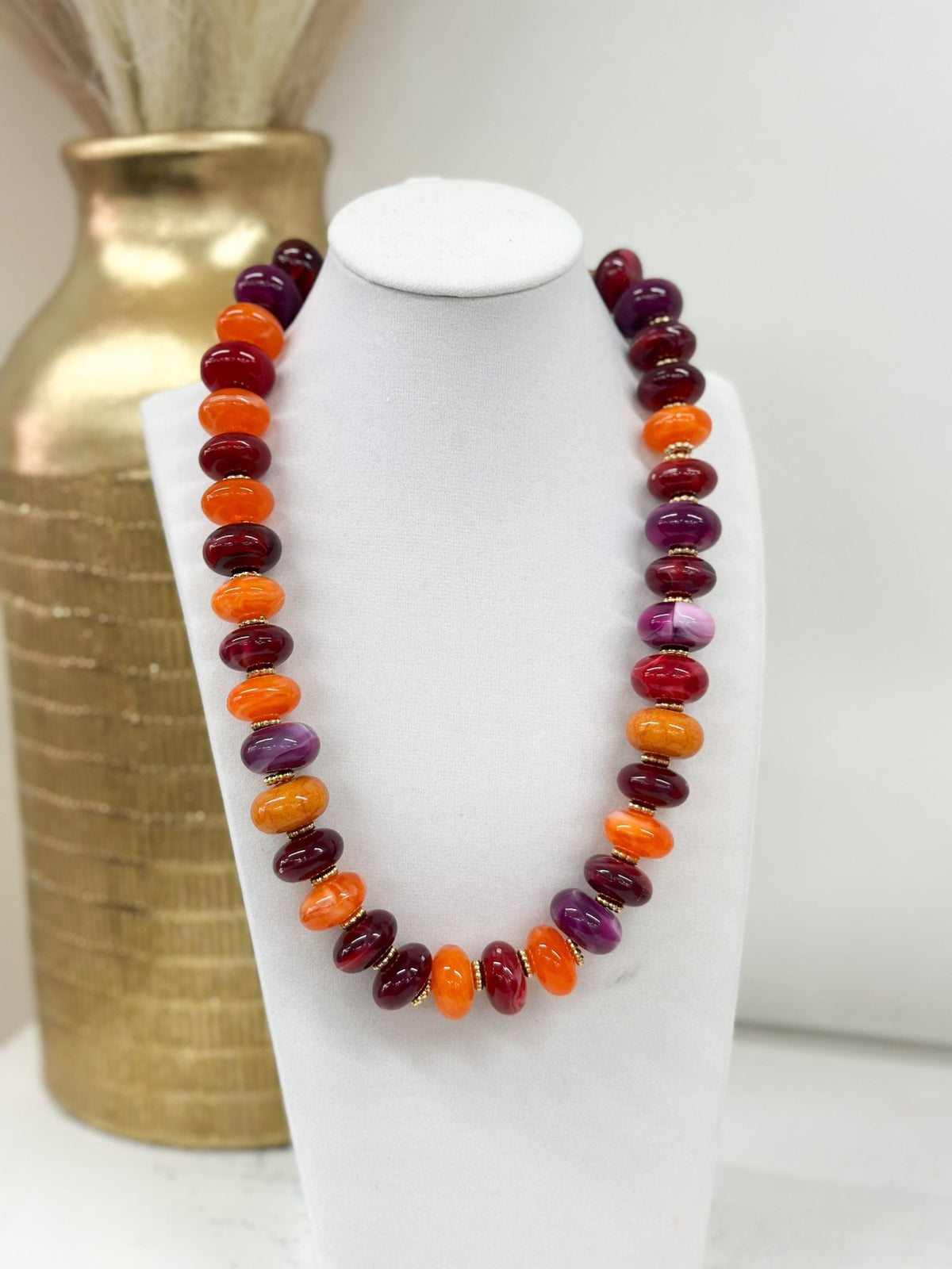 Necklace of flattened beads in a varied color mix