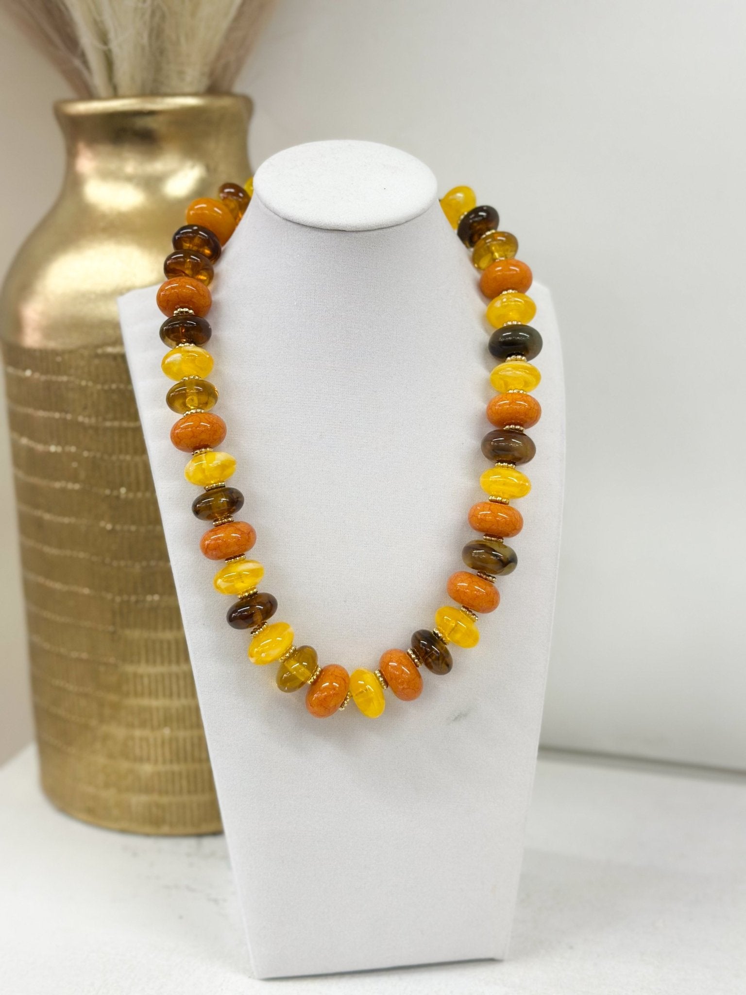 Necklace strung with flat multicolor beads