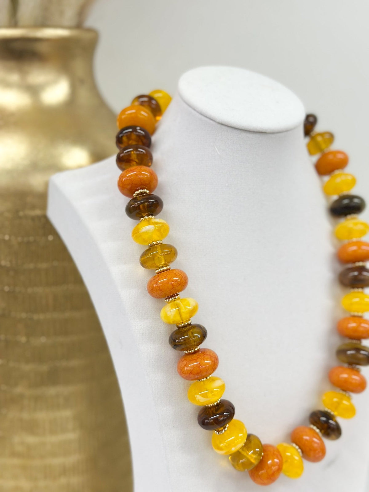 Flat disc beads in mixed colors forming a necklace