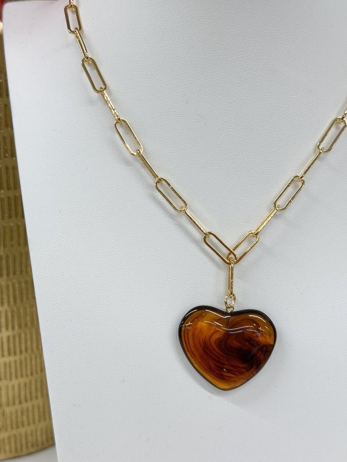 Gold-tone paperclip necklace with a heart charm