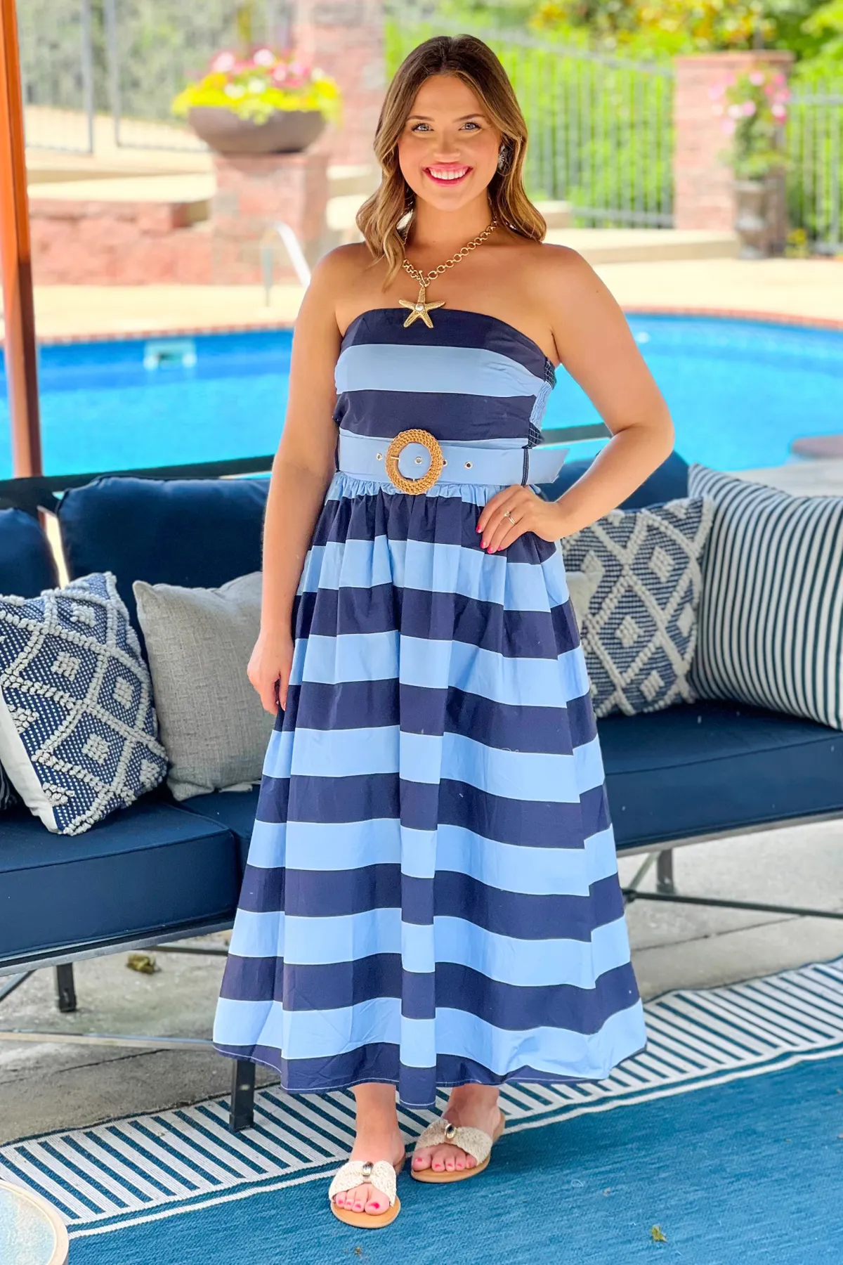 Navy striped strapless dress with a belted waist