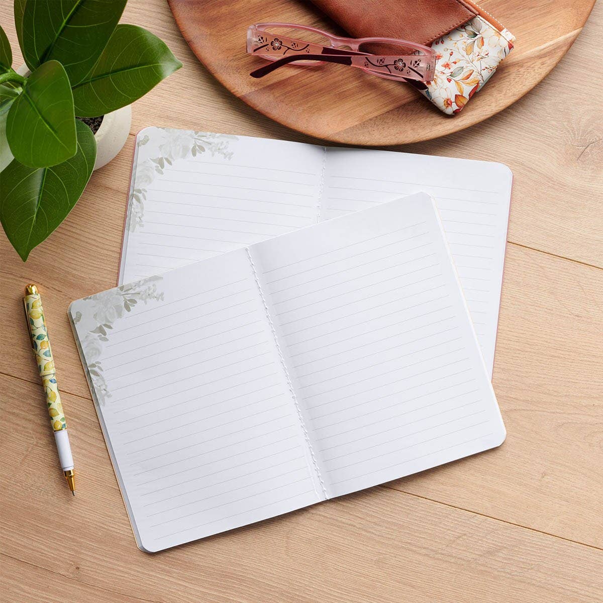 Cream and green floral notebooks sold as a pair