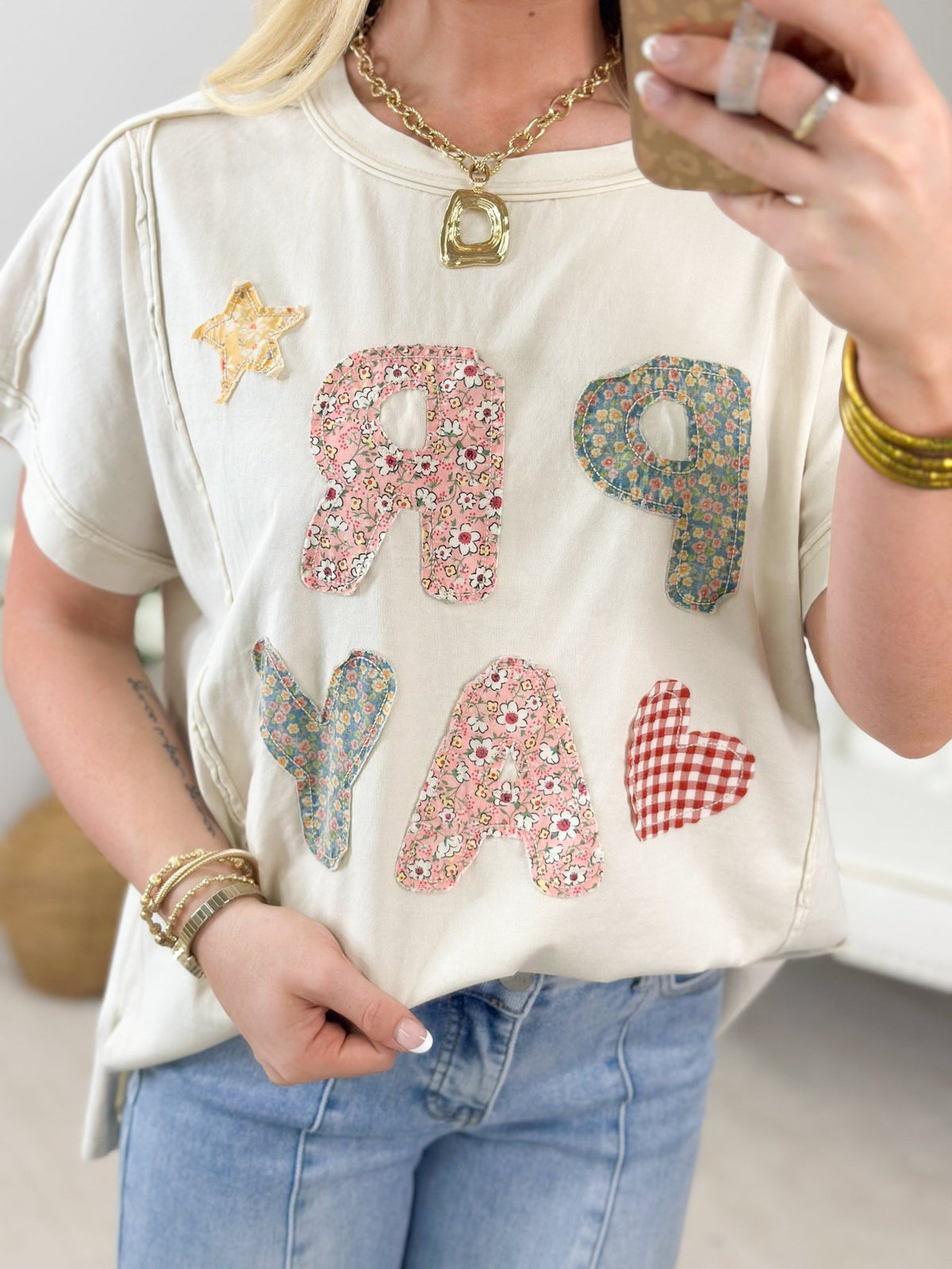Oat coloured tee with a faith slogan print
