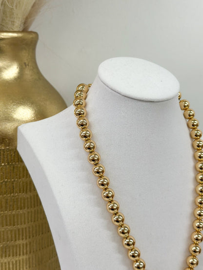 Strand necklace alternating octagon stones and beads