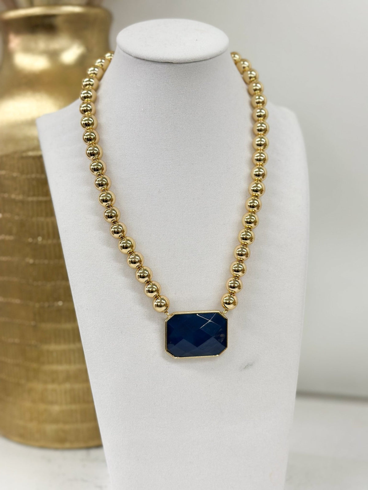 Beaded necklace featuring geometric octagon stones