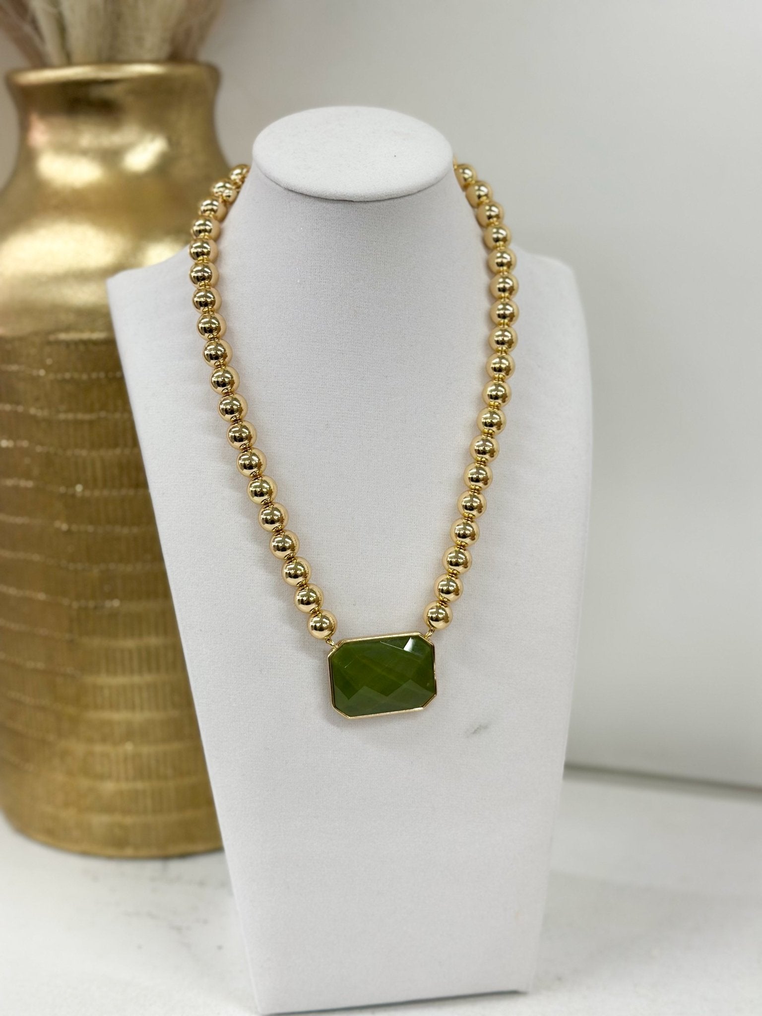 Octagon-cut stone necklace with a beaded strand