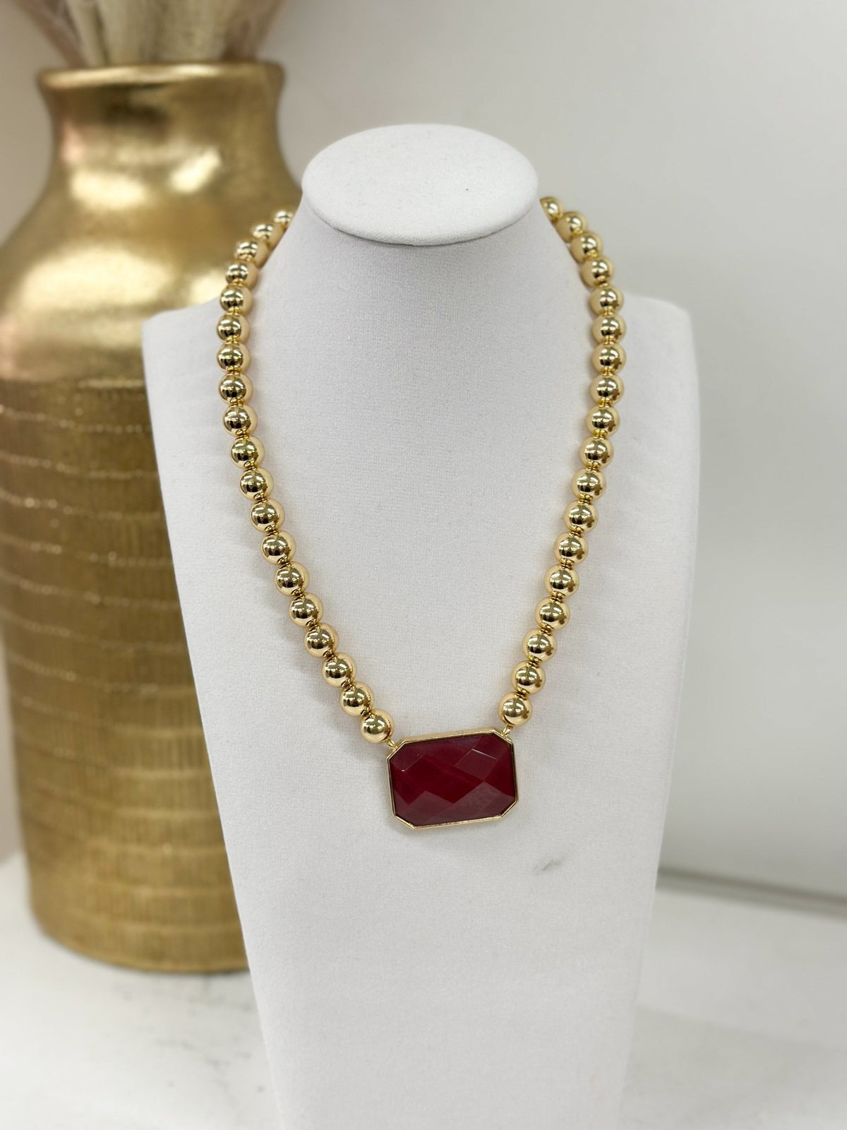 Faceted octagonal stones strung with small beads