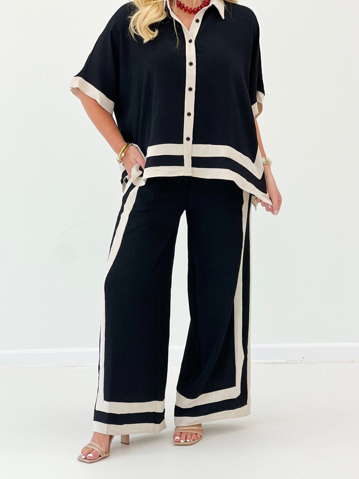 Black short-sleeve wide-leg pant set with button front and striped hem