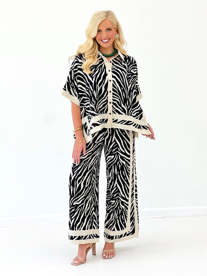 Zebra print button-front top and wide-leg pants set with coordinating waist tie