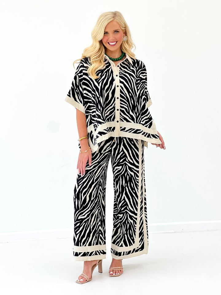 Zebra print button-front top and wide-leg pants set with coordinating waist tie