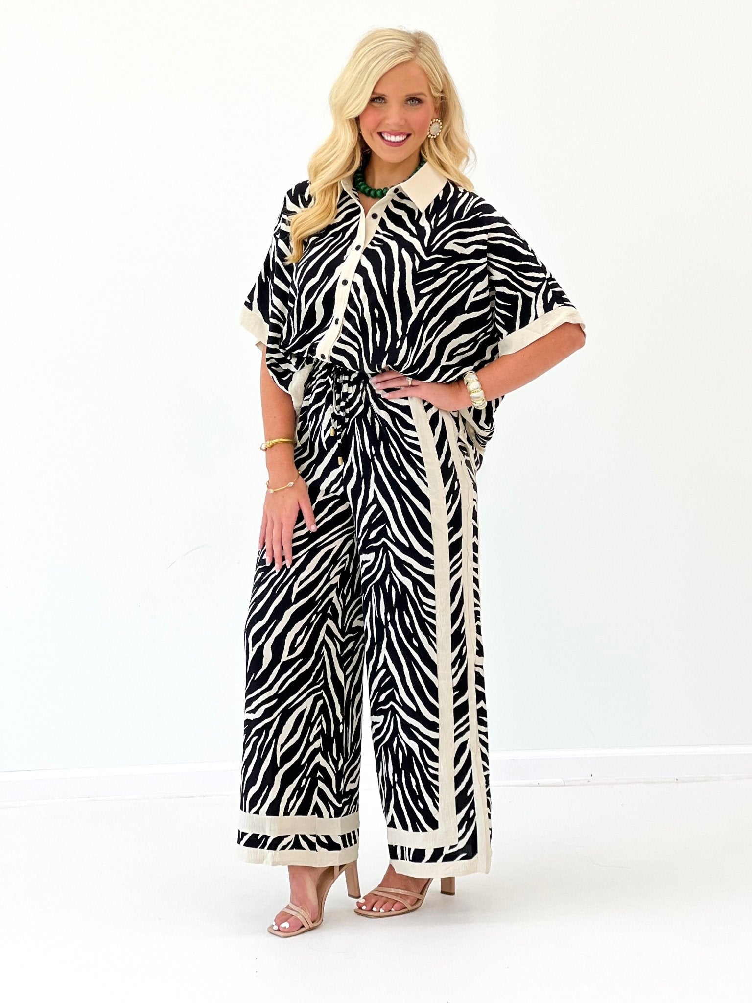 Zebra print button-down top with half sleeves and wide-leg pants, black and white